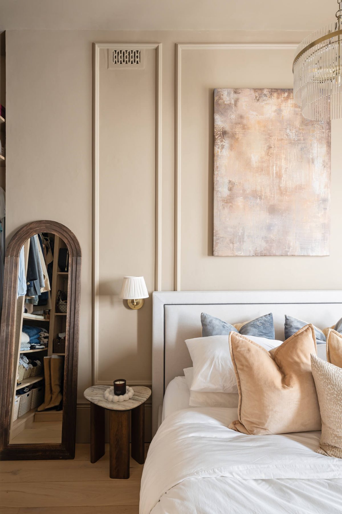 Bedroom panelling, artwork and arched mirror