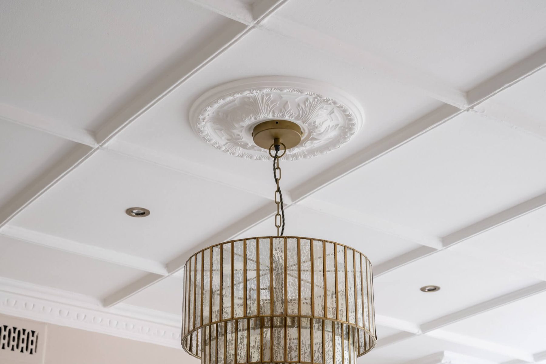 Coffered ceiling with ceiling rose and chandelier