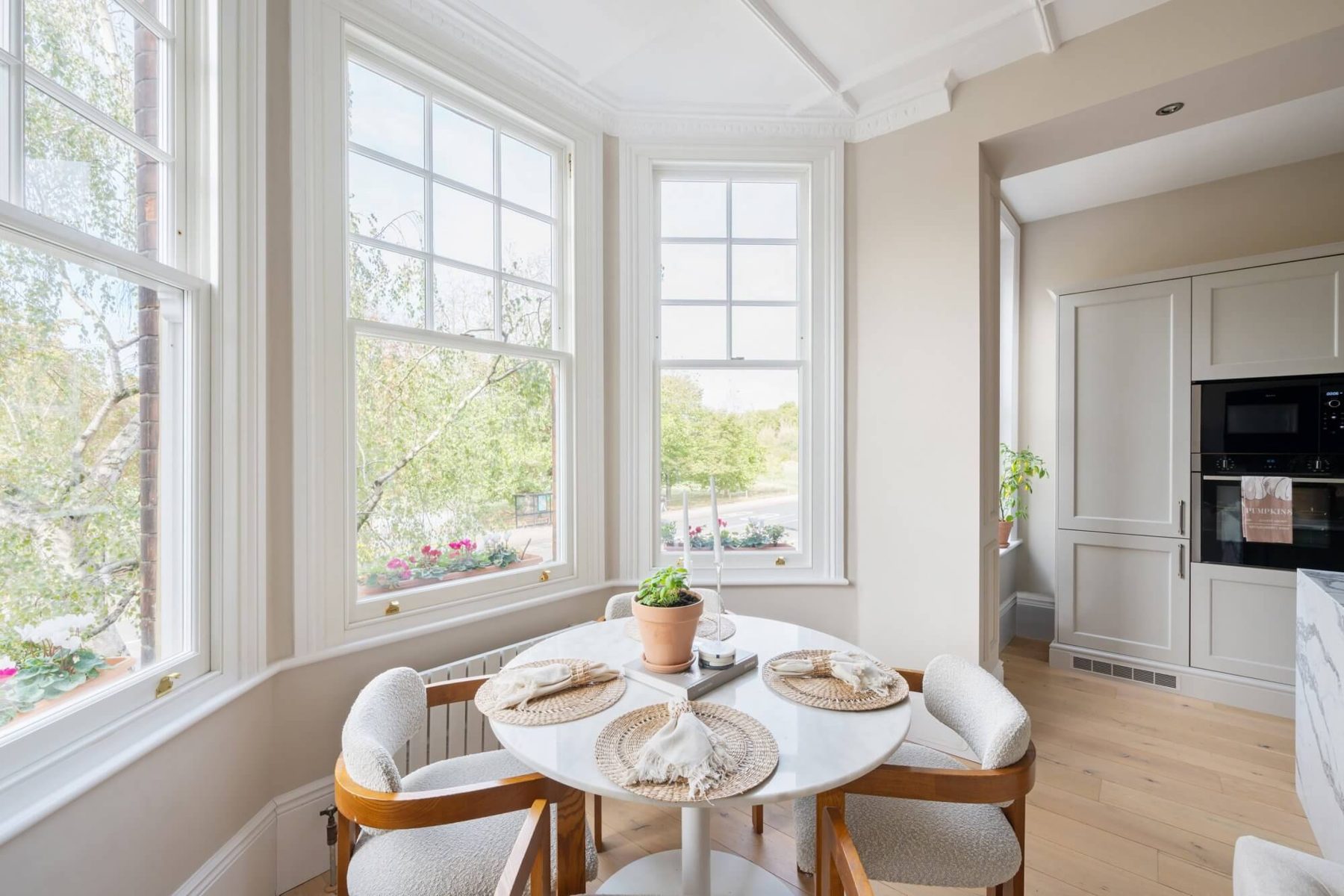 Round dining table in the bay window