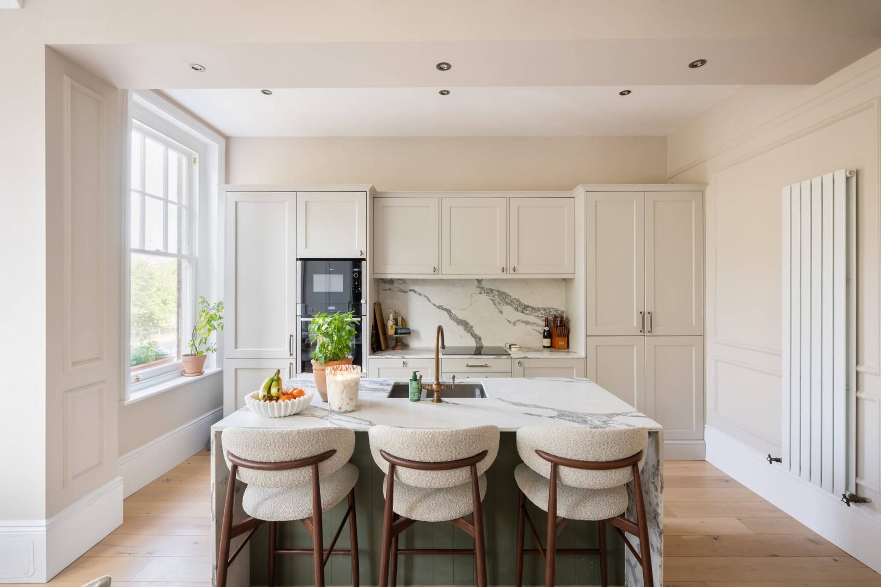 Kitchen island with bouclé stools