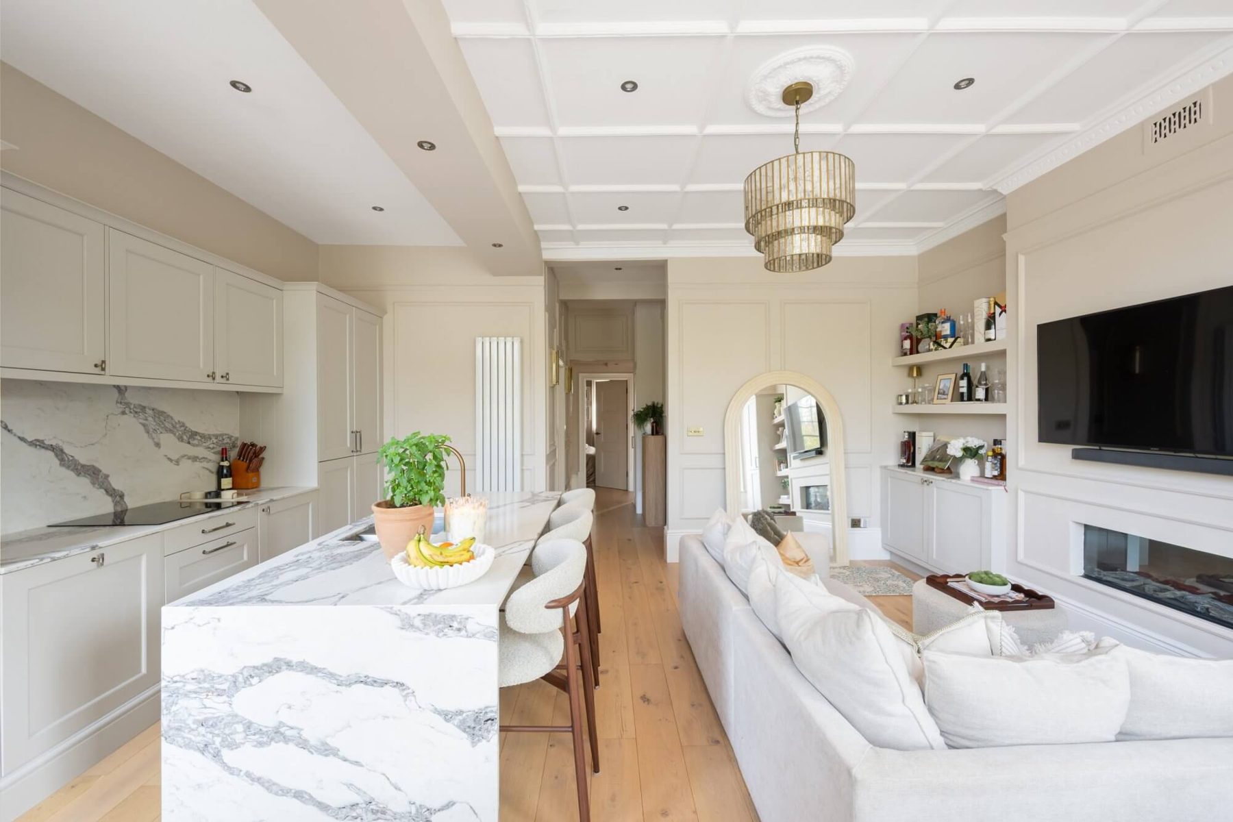 Open-plan kitchen and living space looking towards the hallway