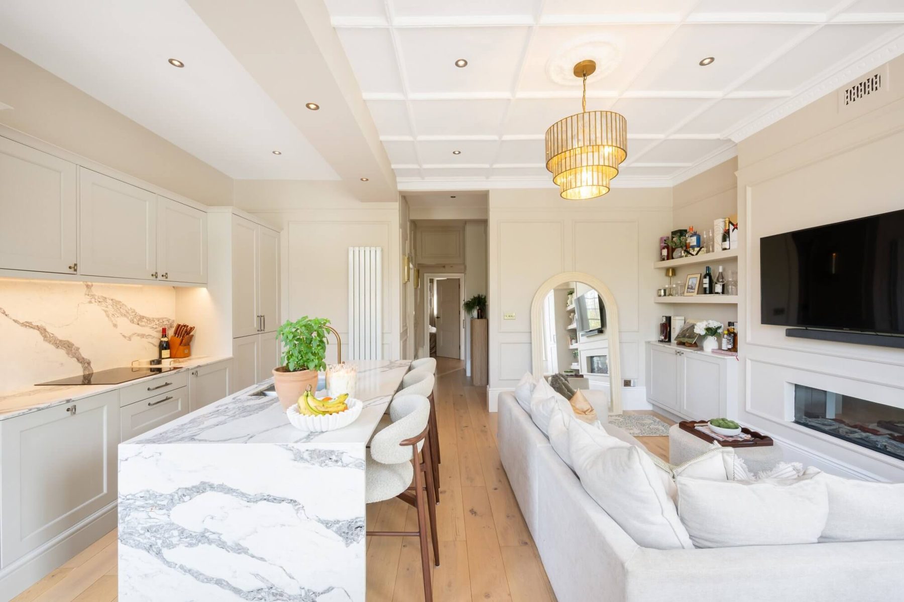 Kitchen with marble splashback and shaker cabinetry