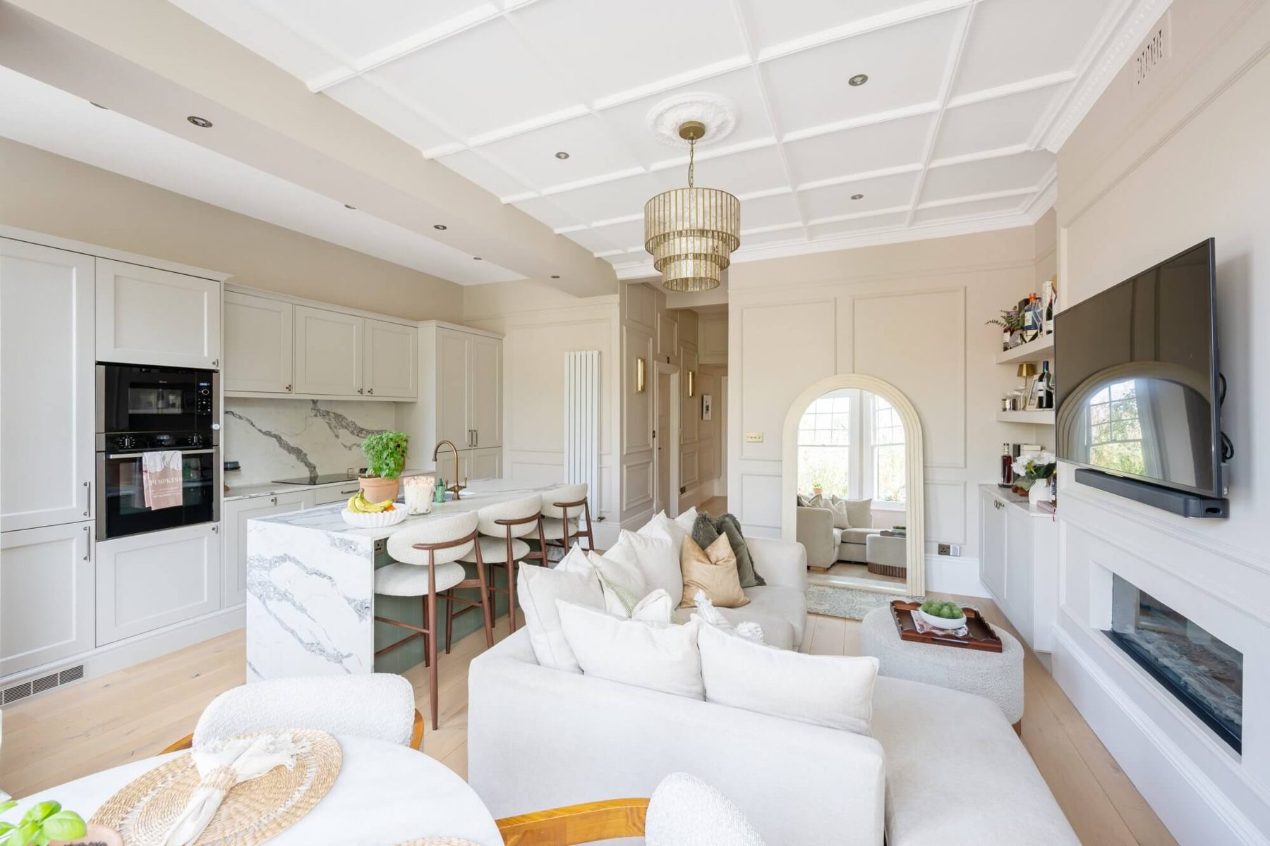 Living room sofa with kitchen beyond